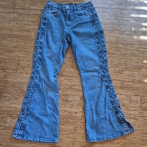 Elegant Blue Flare Jeans with Embroidered Sides